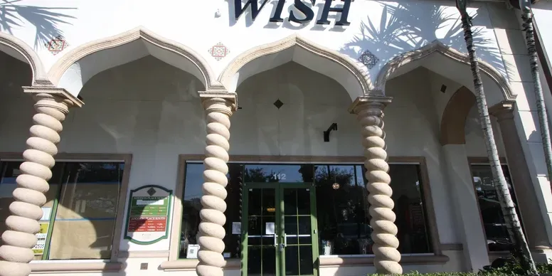 Ornate building facade with arched doorways.