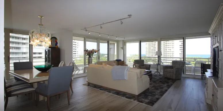 Spacious modern living room with city view.